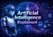 Artificial Intelligence Explained: A Simple Guide for Everyone Ultra-realistic futuristic illustration showing “Artificial Intelligence Explained” 3D text with a humanoid AI robot featuring a glowing transparent brain, surrounded by neural networks, data streams, and digital technology elements.
